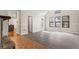Bright living room with large windows, neutral walls and luxury vinyl floors at 801 Hemingway Rd, Stone Mountain, GA 30088
