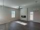 Modern living room with a fireplace, stylish lighting fixtures, and sleek ceiling fan at 5305 Tolar Rd, South Fulton, GA 30213