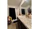 Bathroom with a black shower curtain, ample counter space and vanity at 1367 Midnight Ride Ct, Hampton, GA 30228