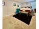 Relaxing bedroom with a queen bed and an accent chair at 1367 Midnight Ride Ct, Hampton, GA 30228