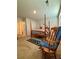 Bright bedroom with a four poster bed, rocking chair and carpeted floors at 1367 Midnight Ride Ct, Hampton, GA 30228