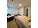 Spacious bedroom featuring natural light and three beds at 1367 Midnight Ride Ct, Hampton, GA 30228