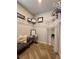 This organized closet is equipped with shelves and features a chair, providing a functional and stylish storage space at 1367 Midnight Ride Ct, Hampton, GA 30228