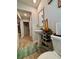 Stylish half bath with pedestal sink and decorative shelving at 1367 Midnight Ride Ct, Hampton, GA 30228