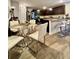 Modern kitchen featuring a center island with bar seating, stainless steel appliances, and a breakfast nook at 1367 Midnight Ride Ct, Hampton, GA 30228