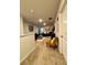 Open-concept living room with neutral carpet, comfortable seating and plenty of natural light at 1367 Midnight Ride Ct, Hampton, GA 30228