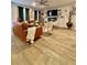Comfortable living room featuring hardwood floors, modern furniture, and natural lighting at 1367 Midnight Ride Ct, Hampton, GA 30228