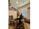 The office includes a desk, zebra-patterned chairs, and shelving along the walls, complemented by a window for natural light at 1367 Midnight Ride Ct, Hampton, GA 30228