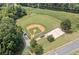 Aerial view of the baseball field and sand volleyball court, perfect for outdoor activities and sports at 2869 Amesbury Nw, Kennesaw, GA 30144