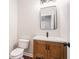 Updated half bathroom with modern vanity, wood floors, and contemporary finishes at 2869 Amesbury Nw, Kennesaw, GA 30144