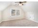 Upstairs bedroom with vaulted ceiling, large window, and neutral carpet at 2869 Amesbury Nw, Kennesaw, GA 30144