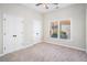 Bedroom features a window, neutral carpet, and closet at 2869 Amesbury Nw, Kennesaw, GA 30144