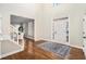Bright foyer features hardwood floors, open staircase, and tall ceilings near the front entrance at 2869 Amesbury Nw, Kennesaw, GA 30144