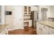 Kitchen features granite countertops, stainless appliances, a desk area, and hardwood floors at 2869 Amesbury Nw, Kennesaw, GA 30144