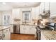 Bright kitchen with stainless appliances, a window over the sink, and stone backsplash at 2869 Amesbury Nw, Kennesaw, GA 30144