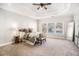 Bright main bedroom features tray ceiling, large windows, and neutral decor at 2869 Amesbury Nw, Kennesaw, GA 30144