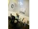 Eat-in dining area has glass table, modern chairs, and unique decorations at 6706 Sunset Valley Cir, Rex, GA 30273