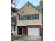 Charming home with a brick facade, a single-car garage, and classic black shutters at 6706 Sunset Valley Cir, Rex, GA 30273