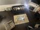 Bright aerial view of living room showcases stylish furniture, fireplace and modern decor at 6706 Sunset Valley Cir, Rex, GA 30273