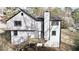 Rear exterior view of a two-story house with gray siding, deck, and walkout basement at 3817 Raiders Ridge Dr, Lithonia, GA 30038