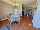 Cozy dining area with hardwood floors and a decorative chandelier providing warm lighting at 3835 Pleasant Oaks Dr, Lawrenceville, GA 30044
