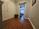 Upstairs hallway with hardwood flooring and two closets near the bedroom entrance at 3835 Pleasant Oaks Dr, Lawrenceville, GA 30044