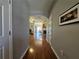 Hallway leading to living areas with hardwood floors at 3835 Pleasant Oaks Dr, Lawrenceville, GA 30044