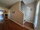 Hallway with hardwood floors leading to the stairs and other rooms at 3835 Pleasant Oaks Dr, Lawrenceville, GA 30044