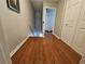 Hallway landing with hardwood floors and closet space at 3835 Pleasant Oaks Dr, Lawrenceville, GA 30044