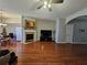 Open living room features hardwood floors, a fireplace, and ample seating at 3835 Pleasant Oaks Dr, Lawrenceville, GA 30044