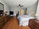 Spacious main bedroom with hardwood floors, ceiling fan, and natural light at 3835 Pleasant Oaks Dr, Lawrenceville, GA 30044