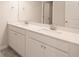 Bathroom featuring a double vanity with white cabinets and modern fixtures, offering ample space at 4853 Walkers Green, Mableton, GA 30126