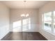 Bright dining room with natural light, chair railing, and hardwood floors at 4853 Walkers Green, Mableton, GA 30126