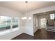 Open-concept dining room featuring hardwood floors and natural light at 4853 Walkers Green, Mableton, GA 30126