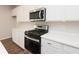 Kitchen with stainless steel appliances, white cabinets, and light countertops at 4853 Walkers Green, Mableton, GA 30126