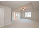 Spacious main bedroom with a tray ceiling, fan, and plenty of natural light from the window at 4853 Walkers Green, Mableton, GA 30126