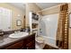 Functional bathroom featuring a vanity with storage, toilet, and shower-tub combination at 4240 N Braves Cir, Douglasville, GA 30135