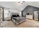 Serene main bedroom features a tufted headboard, carpet flooring, and neutral tones at 4240 N Braves Cir, Douglasville, GA 30135