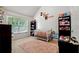 Bedroom with crib and bright natural light at 4240 N Braves Cir, Douglasville, GA 30135
