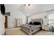 Bright main bedroom featuring high ceilings, a sitting area and neutral decor at 4240 N Braves Cir, Douglasville, GA 30135