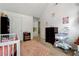 Bedroom with crib and light, airy decor at 4240 N Braves Cir, Douglasville, GA 30135