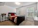 Cozy bedroom with carpet flooring, natural light, and neutral decor for a peaceful retreat at 4240 N Braves Cir, Douglasville, GA 30135