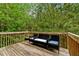 Charming wooden deck surrounded by lush greenery, perfect for relaxation and outdoor enjoyment at 4240 N Braves Cir, Douglasville, GA 30135