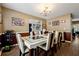Inviting dining room featuring a modern table set, hardwood floors, and a stylish chandelier at 4240 N Braves Cir, Douglasville, GA 30135