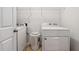 Convenient laundry room with full-size washer and dryer; laundry solutions included at 4240 N Braves Cir, Douglasville, GA 30135