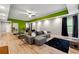 Open-concept living room with modern finishes, comfortable seating, and recessed lighting at 4240 N Braves Cir, Douglasville, GA 30135