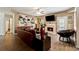 Comfortable living room featuring a fireplace, hardwood floors, and natural light at 4240 N Braves Cir, Douglasville, GA 30135