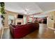 Open-concept living room featuring a fireplace, hardwood floors, and a view into the kitchen at 4240 N Braves Cir, Douglasville, GA 30135