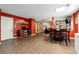 Open-concept living area with a desk nook, dining space, and modern flooring at 4240 N Braves Cir, Douglasville, GA 30135