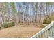 View from the deck overlooking a large backyard bordered by trees at 5810 Ripplestone Nw Ct, Acworth, GA 30101